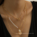 Creative asymmetric shell tassel necklace female retro ot buckle chain multi-layer necklace